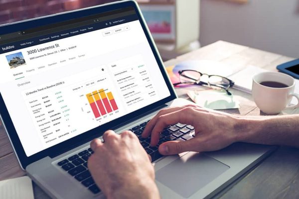 Hands typing on laptop