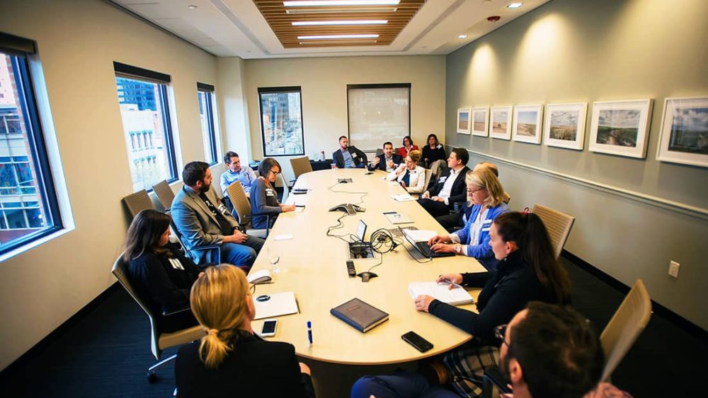 Board members seated at conference table