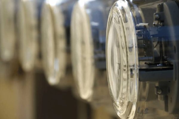 Close-up of multiple glass electric meters