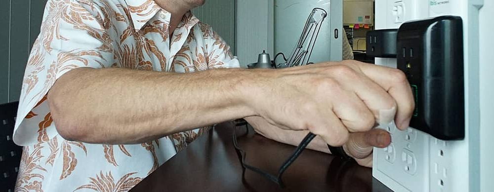 Man plugs in charger
