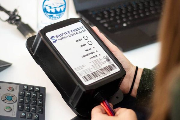 Close up of hands holding battery