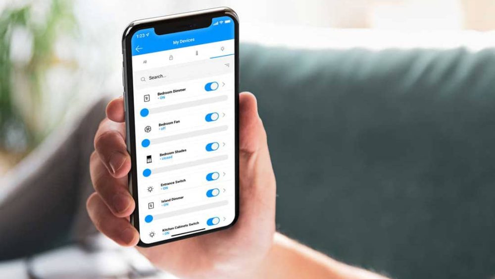 Person holding phone with STRATIS mobile application