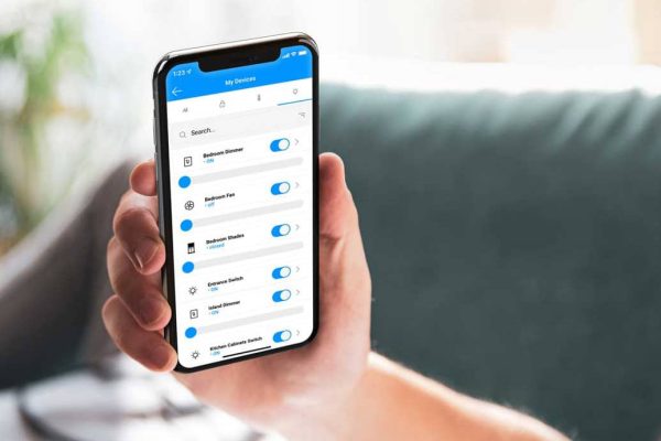 Person holding phone with STRATIS mobile application