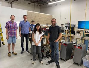 Research group pose for photo