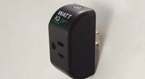 A black smart plug with "WattIQ" written on it against a plain white background.